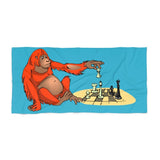 Orangutan playing chess Beach Towel - MateInFour