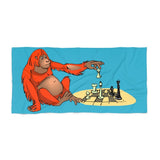 Orangutan playing chess Beach Towel - MateInFour